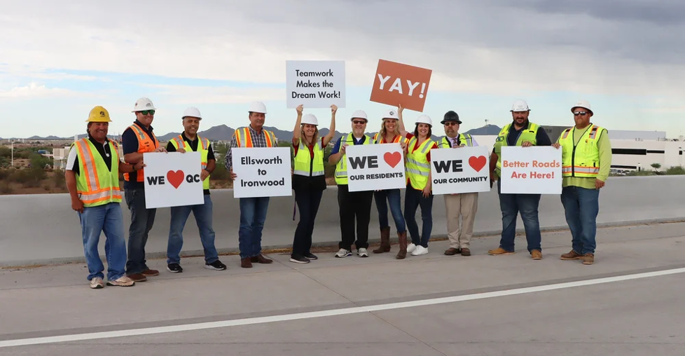 Team holding signs
